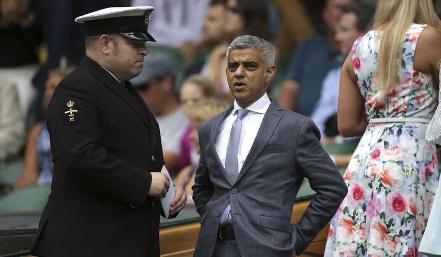 London Mayor Sadiq Khan arrives in the Royal Box for the Men&#39;s Singles final match between Switzerland&#39;s Roger Federer and Croatia&#39;s Marin Cilic on day thirteen at the Wimbledon Tennis Championships in London Sunday, July 16, 2017. (Daniel Leal-Olivas/Pool Photo via AP) ** FILE **