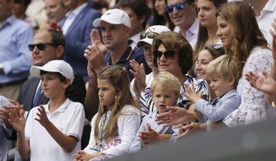 Mirka, the wife of Switzerland&#39;s Roger Federer sits in the players box with their children after he defeated Croatia&#39;s Marin Cilic to win the Men&#39;s Singles final match on day thirteen at the Wimbledon Tennis Championships in London Sunday, July 16, 2017.. (AP Photo/Tim Ireland)