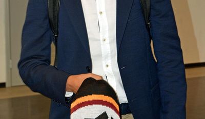 Roma new Turkish midfielder Cengiz Under arrives at the Leonardo da Vinci international airport in Fiumicino, near Rome, Friday, July 14, 2017. (Telenews/ANSA via AP)