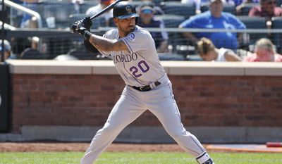 Colorado Rockies&#x27; Ian Desmond (20) waits for a pitch during the sixth inning of a baseball game against the New York Mets, Sunday, July 16, 2017, in New York. Desmond has been activated from the 10-day disabled list by the Rockies. He had been sidelined since July 3 with a strained right calf. (AP Photo/Kathy Willens)