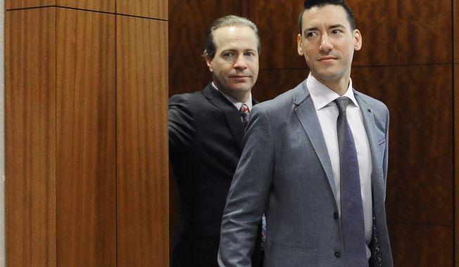 In this April 29, 2016, file photo, David Robert Daleiden, right, with attorney Jared Woodfill leave a courtroom after a hearing in Houston. A federal judge found the anti-abortion activist, known for clandestine videos of abortion-rights advocates, in contempt on Monday, July 17, 2017, after additional secretly-taken recordings appeared online. In a separate legal matter, the 9th U.S. Circuit Court of Appeals on May 16, 2018 dealt a blow to Mr. Daleiden by refusing to toss out a Planned Parenthood lawsuit against the activist&#x27;s organization, the Center for Medical Progress. (AP Photo/Pat Sullivan, File) **FILE**