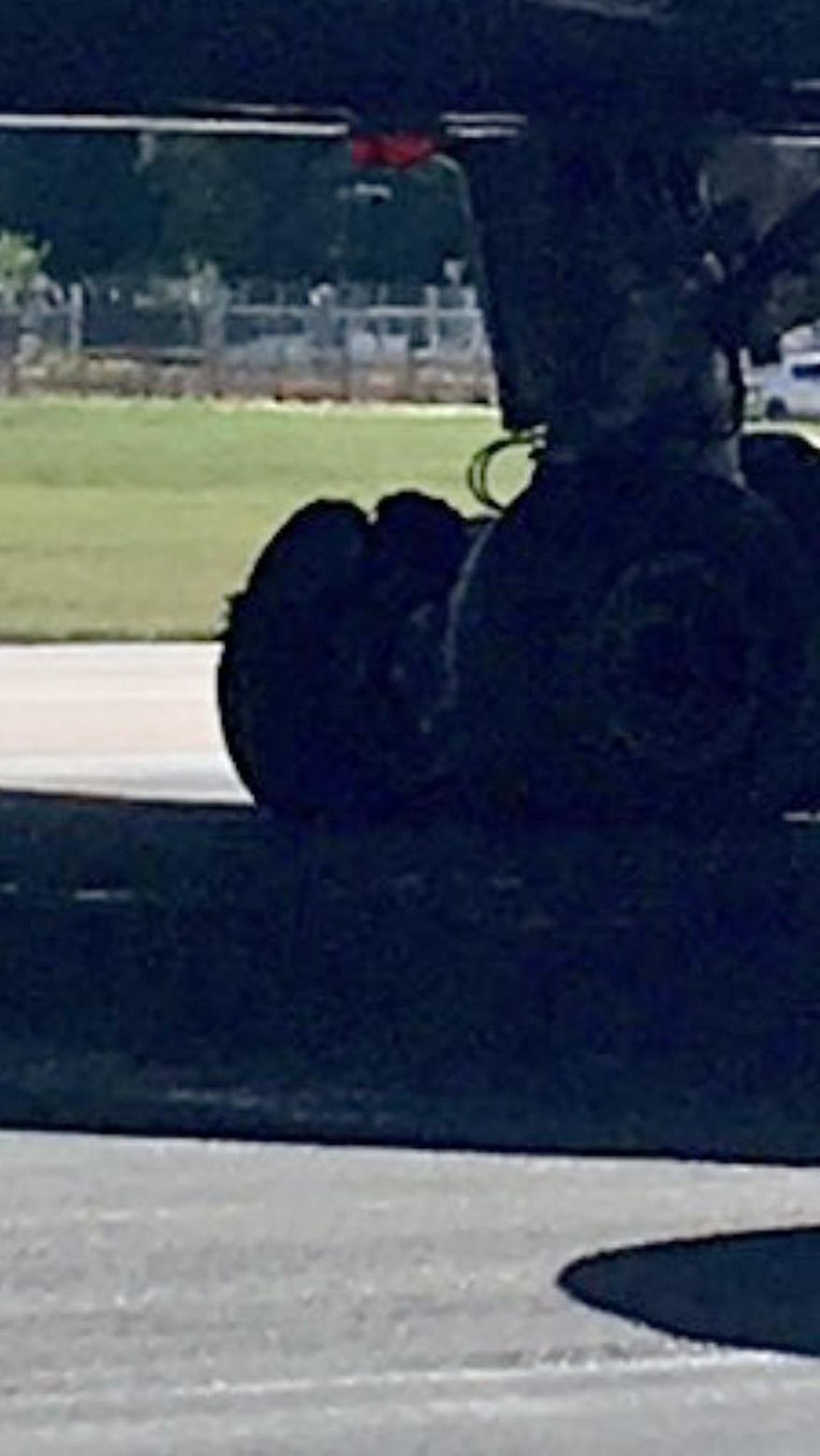In this photo taken from the twitter feed of passenger Mike Gibson, a view of the blown tire of an Air Canada plane which abandoned flight, at London Gatwick , Monday, July 17, 2017. A flight from London to Toronto carrying 282 passengers has been forced to turn back after one of its tires burst as it took off. (Mike Gibson via AP)