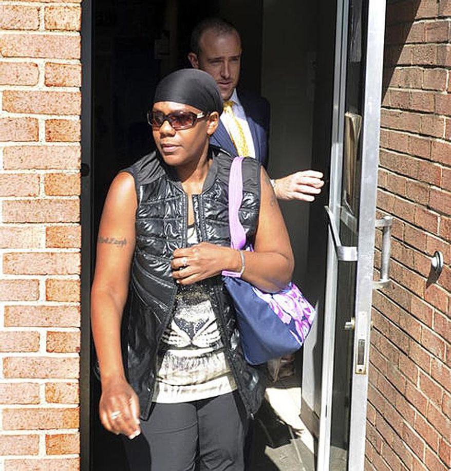 FILE - In this Aug. 22, 2016, file photo, Patricia Fowler leaves a district judge's court in Penn Hills, Pa., after her preliminary hearing was postponed. Fowler, who has been accused of concealing the whereabouts of her twins, who have not been seen in more than 10 years, pleaded guilty on Monday, July 17, 2017, to making false unsworn statements to police in connection with the Allegheny County police investigation of the whereabouts of the twins. (Nate Guidry/Pittsburgh Post-Gazette via AP, File)