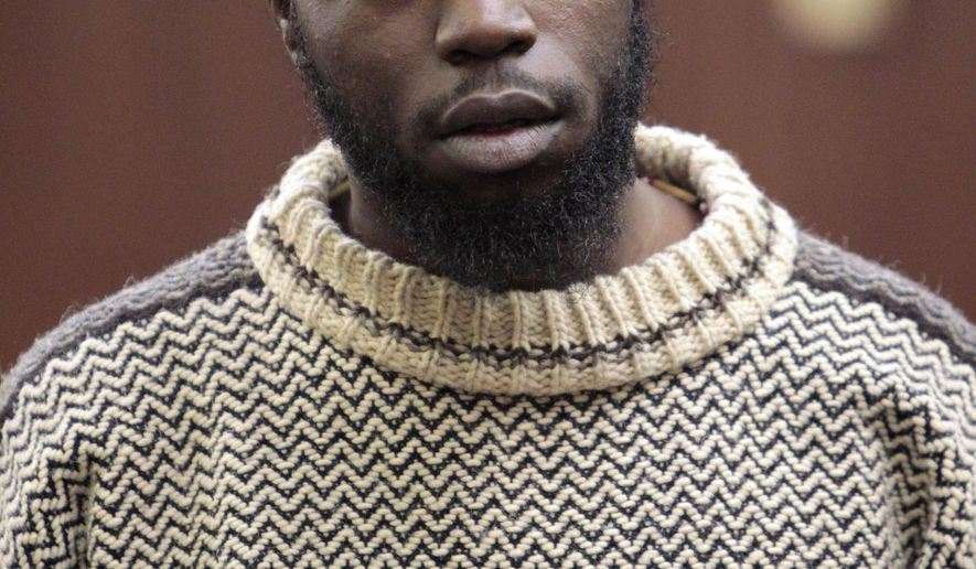FILE - In this Dec. 5, 2012 file photo, Naeem Davis, faces a judge during his arraignment on murder charges in in the death of a New York city subway rider who was shoved onto the tracks. On Monday July 17, 2017, a jury acquitted Davis of killing a stranger by shoving him into the path of a New York City subway train that struck him minutes later. Davis, said he actied in self-defense and that Ki-Suck Han, 58, was the drunken instigator on a train platform near Times Square in December 2012. Davis said that after they accidentally bumped into each other, Han followed him down the platform, berated him with obscenities, grabbed his shoulder and hurled death threats. (New York Post/William C. Lopez via AP, Pool, File)