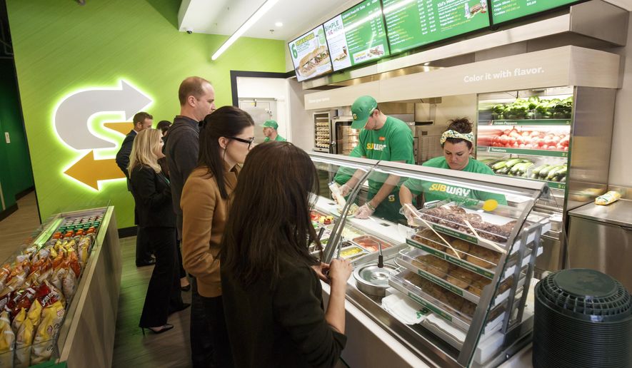 This January 2017 photo provided by Subway shows the interior of a remodeled Subway store in Knoxville, Tenn. Subway is looking to update the look of its stores as the chain's U.S. sales have been declining. The company says the redesign, which includes a brighter atmosphere, displays of vegetables behind the counter and ordering tablets, is the first major revamp since the early 2000s. (Chris Radcliffe/Subway via AP)