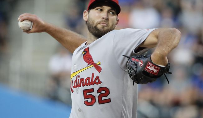 St. Louis Cardinals&#x27; Michael Wacha winds up during the first inning of the team&#x27;s baseball game against the New York Mets on Tuesday, July 18, 2017, in New York. (AP Photo/Frank Franklin II)