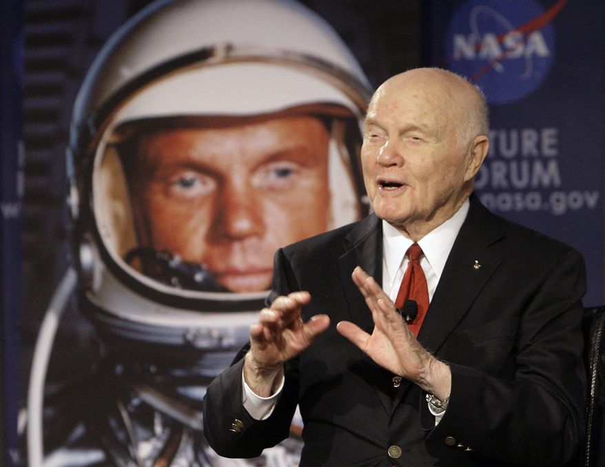FILE – In this Feb. 20, 2012, file photo, U.S. Sen. John Glenn talks with astronauts on the International Space Station via satellite before a discussion titled "Learning from the Past to Innovate for the Future" in Columbus, Ohio. Glenn's devotees are pushing forward with ideas for memorials and honors as the anniversary of the astronaut's birth arrives Tuesday, July 18, 2017, for the first time since his death on Dec. 8, 2016, at age 95. (AP Photo/Jay LaPrete, File)
