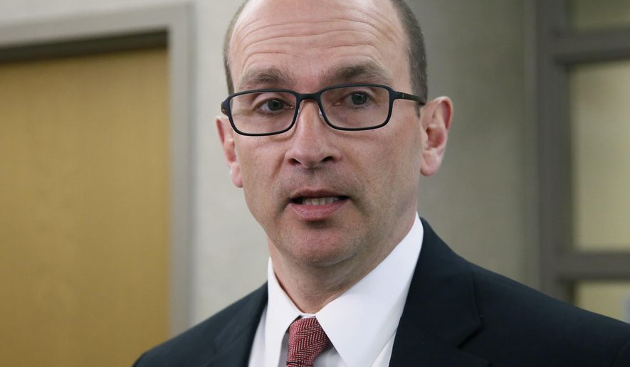 FILE - In this Tuesday, April 11, 2017 file photo, Cleveland County District Attorney Greg Mashburn talks with the media in Norman, Okla. Mashburn is appealing a judge's order to return items confiscated during 2015 raids at a now-closed pipe shop in Norman. (AP Photo/Sue Ogrocki, File)