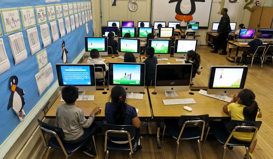 FILE - In this May 15, 2012 file photo, Ritter Elementary School elementary students practice their math skills in Los Angeles. A recent federal court ruling ordering the release of personal data on more than 10 million California students highlights the growing amount of information schools now collect, and the loopholes that allow it to be released. The order involves a lawsuit filed in 2011 in which plaintiffs are requesting data kept by the California Department of Education to determine whether the state is fulfilling its federal obligations for disabled students. (AP Photo/Damian Dovarganes, File)