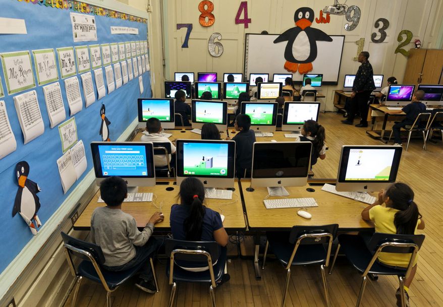 FILE - In this May 15, 2012 file photo, Ritter Elementary School elementary students practice their math skills in Los Angeles. A recent federal court ruling ordering the release of personal data on more than 10 million California students highlights the growing amount of information schools now collect, and the loopholes that allow it to be released. The order involves a lawsuit filed in 2011 in which plaintiffs are requesting data kept by the California Department of Education to determine whether the state is fulfilling its federal obligations for disabled students. (AP Photo/Damian Dovarganes, File)