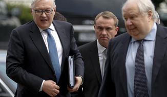 Russian Deputy Foreign Minister Sergei Ryabkov, left, and Russian Ambassador to the U.S. Sergey Kislyak, right, arrive at the State Department in Washington, Monday, July 17, 2017, to meet with Undersecretary of State Thomas Shannon. (AP Photo/Carolyn Kaster)