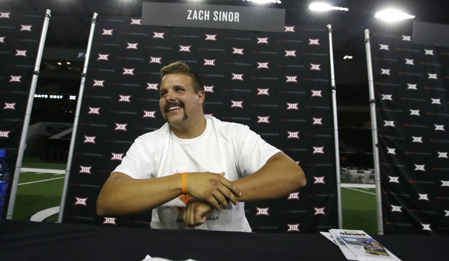 Oklahoma State punter Zach Sinor smiles while giving an interview during the Big 12 NCAA college football media day in Frisco, Texas, Tuesday, July 18, 2017. (AP Photo/LM Otero)