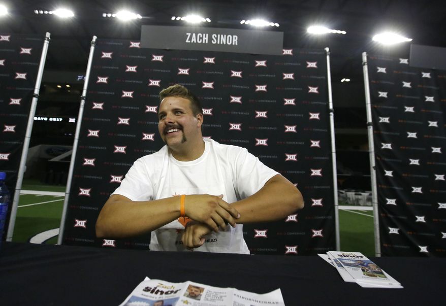 Oklahoma State punter Zach Sinor smiles while giving an interview during the Big 12 NCAA college football media day in Frisco, Texas, Tuesday, July 18, 2017. (AP Photo/LM Otero)