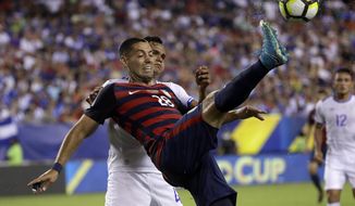 United States&#39; Clint Dempsey (28) is defended by El Salvador&#39;s Henry Romero (4) during a CONCACAF Gold Cup quarterfinal soccer match in Philadelphia, Wednesday, July 19, 2017. (AP Photo/Matt Rourke)