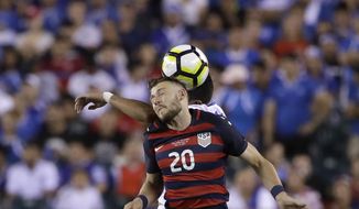 United States&#39; Paul Arriola (20) and El Salvador&#39;s Victor Garcia (17) jump for a header during a CONCACAF Gold Cup quarterfinal soccer match in Philadelphia, Wednesday, July 19, 2017. (AP Photo/Matt Rourke)