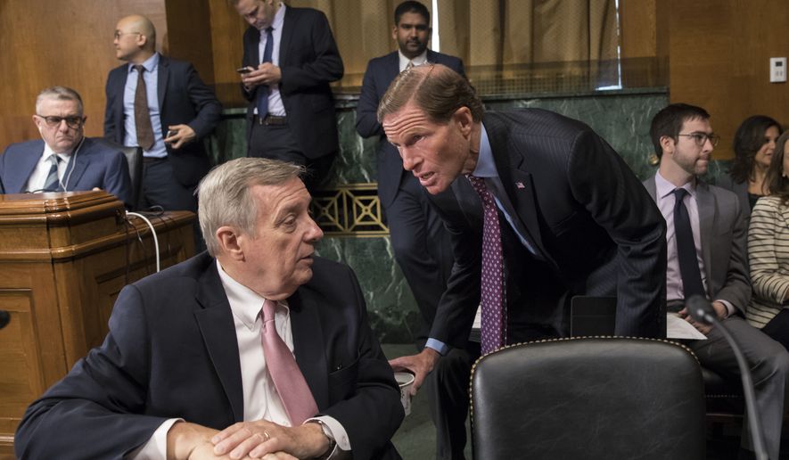 Sen. Dick Durbin, D-Ill., left, confers with Sen. Richard Blumenthal, D-Conn., as the Senate Judiciary Committee meets to to advance the nomination of Christopher Wray, President Donald Trump&#39;s pick to lead the FBI, on Capitol Hill in Washington, Thursday, July 20, 2017. (AP Photo/J. Scott Applewhite)