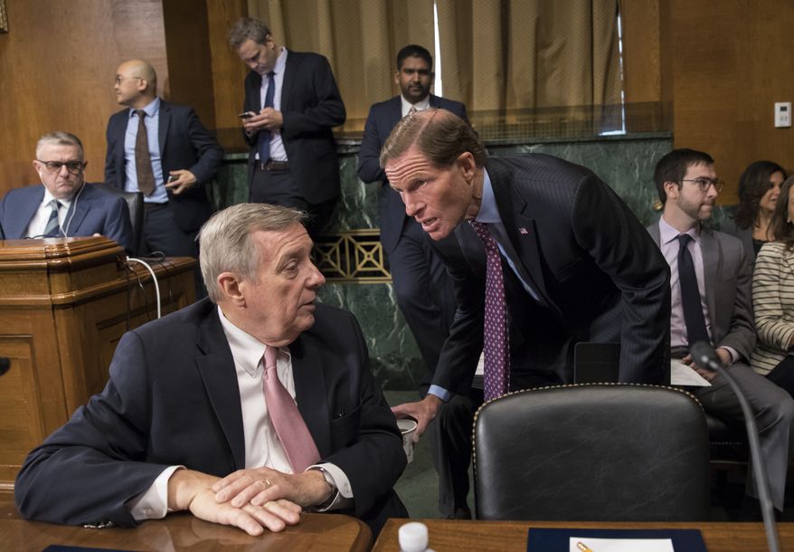 Sen. Dick Durbin, D-Ill., left, confers with Sen. Richard Blumenthal, D-Conn., as the Senate Judiciary Committee meets to to advance the nomination of Christopher Wray, President Donald Trump&#39;s pick to lead the FBI, on Capitol Hill in Washington, Thursday, July 20, 2017. (AP Photo/J. Scott Applewhite)