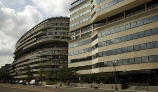 The Watergate Complex is seen in Washington, on Tuesday, July 21, 2009. The Watergate Hotel, part of a complex made famous by a presidential scandal, is heading to the auction block Tuesday. (AP Photo/Jacquelyn Martin)