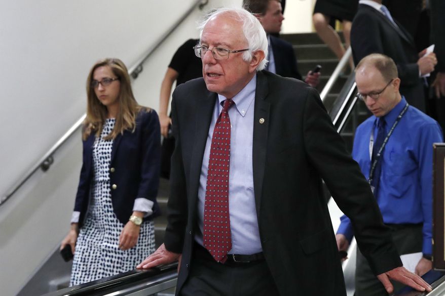 In this July 11, 2017, file photo, Sen. Bernie Sanders, I-Vt., rides an escalator on Capitol Hill in Washington. (AP Photo/Jacquelyn Martin, File)