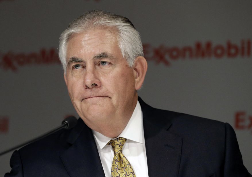 In this May 28, 2014 file photo, ExxonMobil CEO Rex Tillerson listens to a reporter&#39;s question after the annual meeting ExxonMobil shareholders meeting in Dallas. The Treasury Department hit Exxon Mobil Corp. with a $2 million fine Thursday for violating Russia sanctions while Secretary of State Rex Tillerson was the oil company’s CEO. (AP Photo/LM Otero, File)