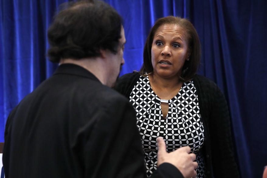 Kim Keenan, President and CEO of the Multicultural Media, Telecom, and Internet Council, right, answers questions after speaking about an initiative to train volunteers around the country on the best ways to use cell phones to videotape law enforcement in hopes of discouraging police misconduct among minority communities, Thursday, July 20, 2017, in Washington. (AP Photo/Jacquelyn Martin)