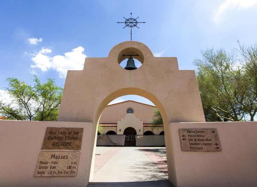 This Tuesday, July 18, 2017 photo shows Our Lady of Joy Catholic Church in Carefree, Ariz., where Maria Raya-Garcia and her husband Hector Miguel Garnica worshipped and had their children baptized. Tragedy has left a hole in the Arizona community after the close-knit family and several extended family members were lost in a flash flood in a rocky canyon north of Phoenix while celebrating Raya-Garcia's birthday on Saturday, July 15. (AP Photo/Angie Wang)