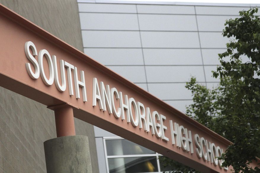 This June 27, 2017, photo shows the exterior of South Anchorage High School in Anchorage, Alaska. Arconic says 20,000 square feet of Reynobond®ACM PE core was used for the metallic facade to differentiate the building entrances and science classrooms at the high school built in 2004. In sales brochures, a U.S. company boasted of the “stunning visual effect” its shimmering aluminum panels created in an NFL stadium, an Alaskan school and a 33-story hotel on Baltimore’s waterfront. Those same panels also were used in London’s Grenfell Tower. (AP Photo/Mark Thiessen)