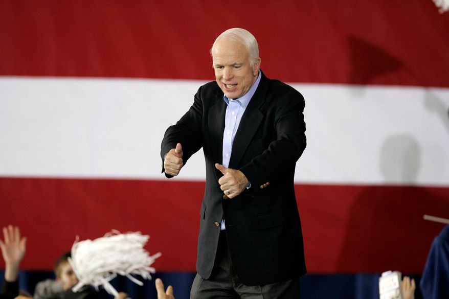 FILE - In this Nov. 3, 2008, file photo, then-Republican presidential candidate, Sen. John McCain, R-Ariz., departs a rally in a hanger at Pittsburgh International Airport in Moon Township, Pa. (AP Photo/Gene J. Puskar, File)