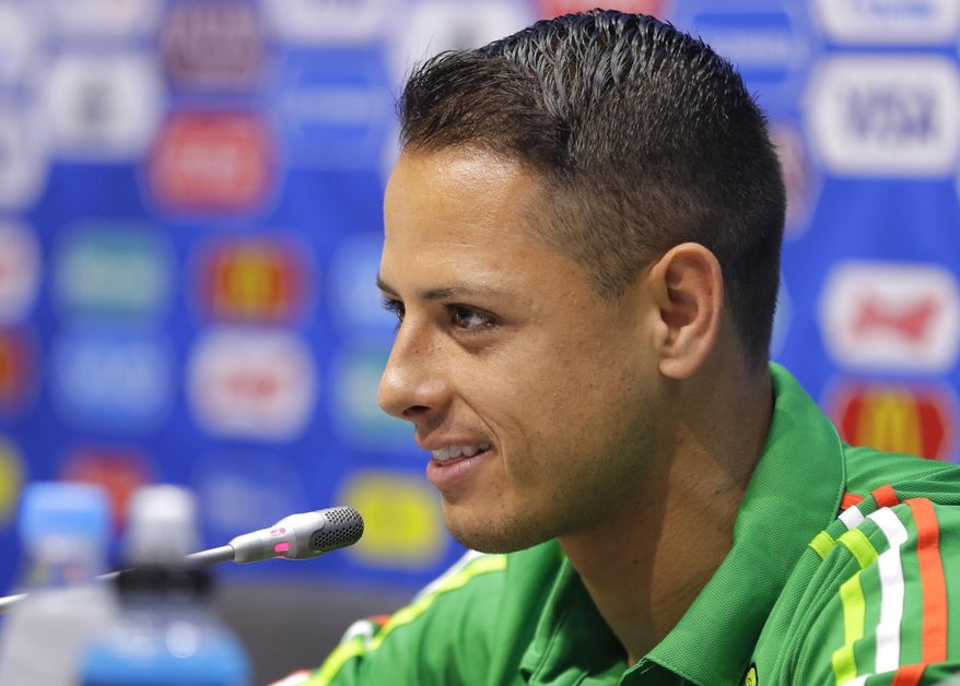 FILE - A Wednesday, June 28, 2017, file photo of  Javier Hernandez speaking during a news conference at the Fisht Stadium in Sochi, Russia.  Hernandez is heading back to the Premier League with West Ham. The London club said Thursday, July 20, 2017,  it has agreed terms with Bayer Leverkusen for the transfer of Hernandez, who was previously at Manchester United from 2010 to 2015. (AP Photo/Sergei Grits, File)