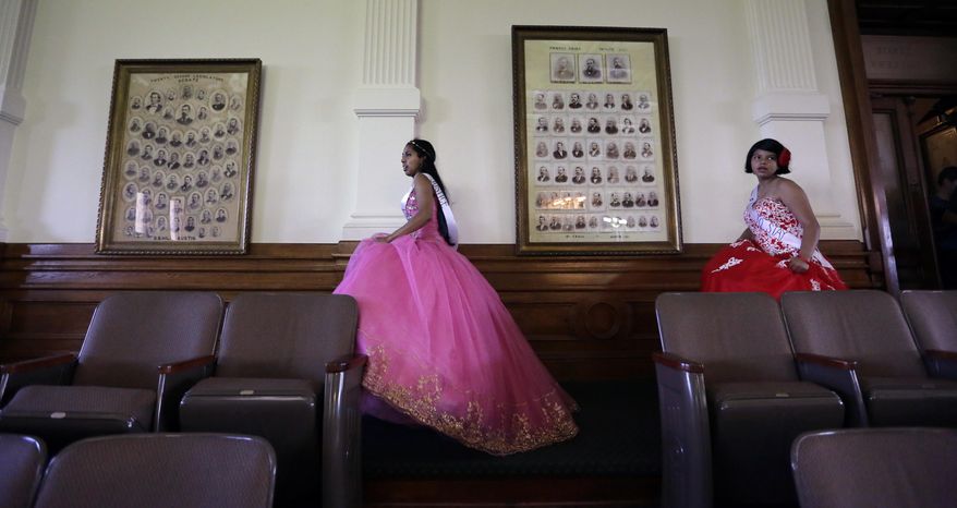 Young women dressed as Quinceaneras walk through the Senate Chambers at the Texas Capitol to visit lawmakers as they protest SB4, an anti-"sanctuary cities" bill, in Austin, Texas, Wednesday, July 19, 2017. Texas' special session continues and conservatives in the legislature plan to work on anti-abortion measures, school vouchers and defanging local ordinances in Texas' big and liberal cities. (AP Photo/Eric Gay)