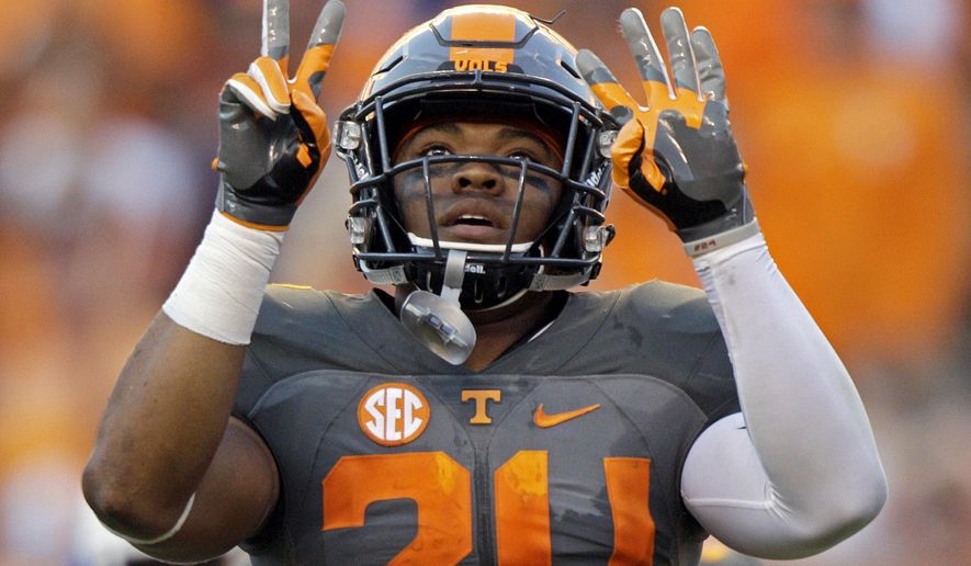 FILE - In this Sept. 24, 2016, file photo, Tennessee defensive back Todd Kelly Jr. (24) gestures after an interception during the second half of an NCAA college football game against Florida, in Knoxville, Tenn. Tennessee doesn’t mind adopting an underdog mentality a year after the Volunteers failed to meet preseason expectations. “Right now we’re in the weeds,” senior safety Todd Kelly Jr. said. “No one’s really seeing us, almost like a snake in the grass. Our goal is to end up biting somebody at the end of the day and making them pay.” (AP Photo/Wade Payne, File)