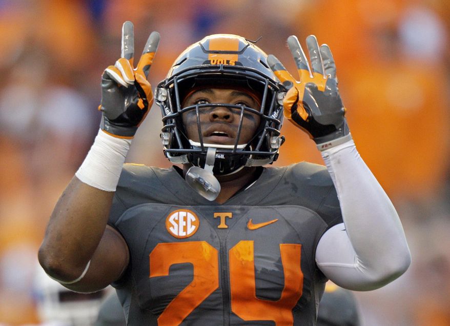 FILE - In this Sept. 24, 2016, file photo, Tennessee defensive back Todd Kelly Jr. (24) gestures after an interception during the second half of an NCAA college football game against Florida, in Knoxville, Tenn. Tennessee doesn’t mind adopting an underdog mentality a year after the Volunteers failed to meet preseason expectations. “Right now we’re in the weeds,” senior safety Todd Kelly Jr. said. “No one’s really seeing us, almost like a snake in the grass. Our goal is to end up biting somebody at the end of the day and making them pay.” (AP Photo/Wade Payne, File)
