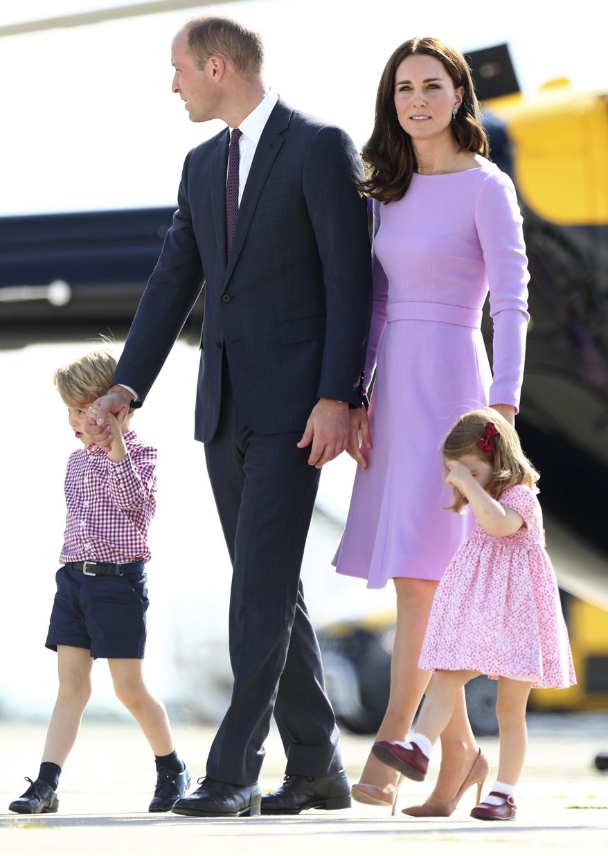 Britain&#39;s Prince William, second left, and his wife Kate, the Duchess of Cambridge, second right, and their children, Prince George, left, and Princess Charlotte, right look at helicopters during their visit to Airbus in Hamburg, Germany, Friday, July 21, 2017.  ( Christian Charisius/Pool Photo via AP)