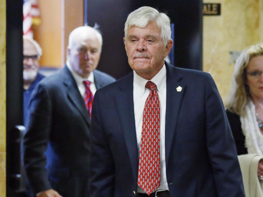 FILE - In this July 15, 2016, file photo, former Tulsa County Sheriff Stanley Glanz leaves a Tulsa County courtroom in Tulsa, Okla. According to a federal lawsuit filed Thursday, July 20, 2017, Glanz forced Tulsa County Sheriff&#39;s Maj. Tom Huckeby, a former high-ranking sheriff&#39;s official, to &amp;quot;take the hit&amp;quot; and resign following the shooting of an unarmed black man by a white reserve deputy whose qualifications subsequently came under heavy scrutiny. (AP Photo/Sue Ogrocki, File)