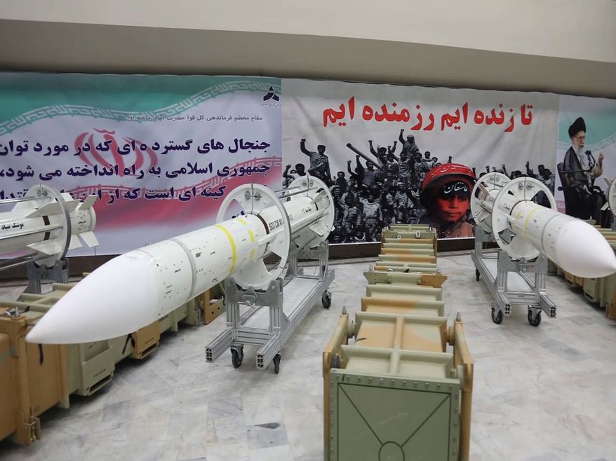 This picture released by the official website of the Iranian Defense Ministry on Saturday, July 22, 2017, shows Sayyad-3 air defense missiles during inauguration of its production line at an undisclosed location, Iran, according to official information released. Sayyad-3 is an upgrade to previous versions of the missile. Writing on the banner at right reads in Persian: &quot; We are fighters as long as we are alive&quot;. (Iranian Defense Ministry via AP)