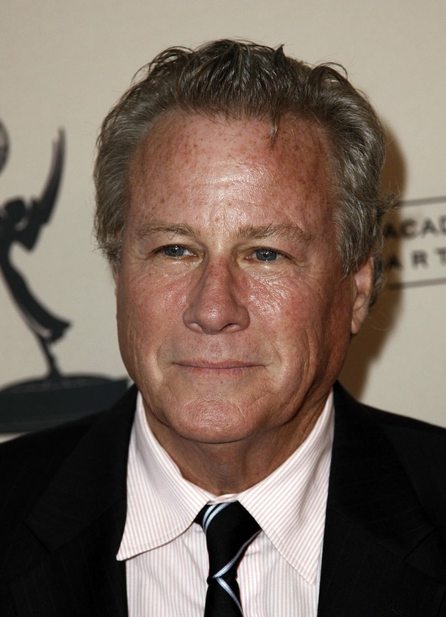 FILE - In this Sept. 12, 2011 file photo, actor John Heard arrives at Academy of Television Arts and Sciences Producers Peer Group celebration of the 63rd Primetime Emmy Awards in Los Angeles. Heard, best known for playing the father in the “Home Alone” movie series, has died. He was 72. His death was confirmed by the Santa Clara Medical Examiner’s office in California on Saturday, July 22, 2017. (AP Photo/Matt Sayles)
