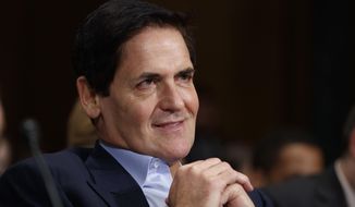 Dallas Mavericks owner Mark Cuban listens on Capitol Hill in Washington while testifying before a Senate Judiciary subcommittee hearing on the proposed merger between AT&amp;T and Time Warner, Dec. 7, 2016. (AP Photo/Evan Vucci) ** FILE **