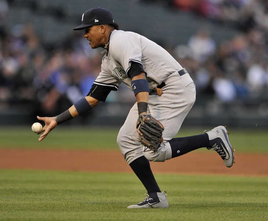 FILE - In this June 26, 2017, file photo, New York Yankees second baseman Starlin Castro bobbles a single hit by Chicago White Sox&#39;s Jose Abreu during the first inning of a baseball game in Chicago. Castro will be placed on the disabled list with another injury to his right hamstring, manager Joe Girardi said Saturday, July 22. Castro, activated off the disabled on July 15, reinjured his hamstring while running out a ground ball on Wednesday at Minnesota. He played in the first two games of the series at Seattle on Thursday and Friday with one hit in eight at-bats. (AP Photo/Paul Beaty, File)