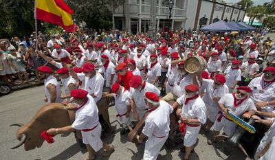 In this photo provided by the Florida Keys News Bureau, Ernest Hemingway look-alikes begin the Running of the Bulls Saturday, July 22, 2017, in Key West, Fla. The offbeat answer to the event&#x27;s namesake in Pamplona, Spain, the activity was part of Key West&#x27;s Hemingway Days festival. Hemingway lived in Key West in the 1930s and the island city&#x27;s annual celebration continues through Sunday, July 23. (Andy Newman/Florida Keys News Bureau via AP)