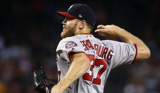 Washington Nationals&#39; Stephen Strasburg throws a pitch against the Arizona Diamondbacks during the first inning of a baseball game Sunday, July 23, 2017, in Phoenix. (AP Photo/Ross D. Franklin)