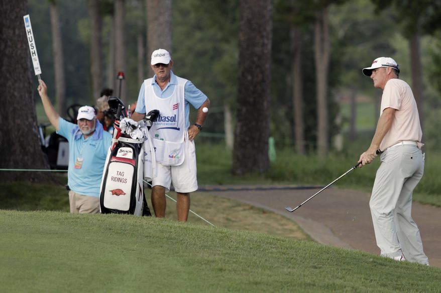 Tag Riding, right, chips to the green on 18 during the third round of the Barbasol Championship golf tournament Saturday, July 22, 2017, in Opelika, Ala. (Todd J. Van Emst/Opelika-Auburn News via AP)