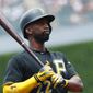 Pittsburgh Pirates&#39; Andrew McCutchen reacts after swinging and missing a pitch from Colorado Rockies starter Kyle Freeland in the first inning of a baseball game Sunday, July 23, 2017, in Denver.(AP Photo/David Zalubowski)