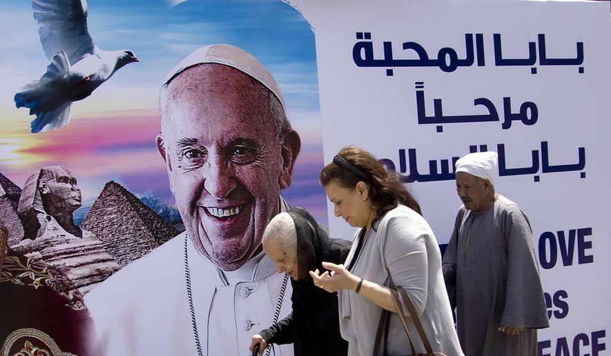 A billboard welcomes Pope Francis, at St. Mark&#x27;s Cathedral in Cairo, Egypt, Thursday, April 27, 2017. On Friday, Francis is scheduled to begin a two-day pilgrimage to Egypt aimed at lifting the spirits of Christians in the Middle East, whose numbers have rapidly dwindled in recent decades due to war, displacement and emigration. The visit will include a meeting with Egypt&#x27;s president and the Grand Imam of Al-Azhar as well as a Mass in a stadium on the outskirts of Cairo. (AP Photo/Amr Nabil)