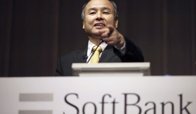 FILE - In this Nov. 4, 2014 file photo, SoftBank founder and Chief Executive Officer Masayoshi Son speaks during a news conference in Tokyo. Softbank and China&#39;s top ride-hailing firm Didi Chuxing are pouring $2 billion into the latest round of financing by cash-hungry Southeast Asian taxi app Grab.  Grab said Monday, July 24, 2017, that it expects another $500 million will come from other existing and new investors. Its last announced cash injection was in September when it raised $750 million led by Softbank, whose chief executive Son is Japan&#39;s richest person and a self-styled tech visionary. (AP Photo/Eugene Hoshiko, File)
