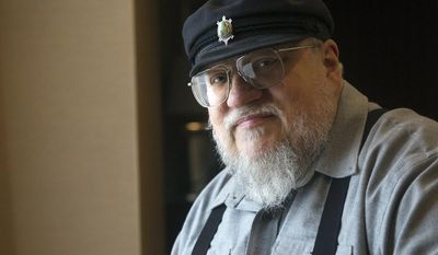 FILE - In this March 12, 2012 file photo, George R.R. Martin, author of the popular book series &amp;quot;A Song of Ice and Fire,&amp;quot; which inspired the hit HBO series &amp;quot;Game of Thrones&amp;quot; poses in Toronto. Martin says the next “Song of Ice and Fire” book has a real chance of coming out in 2018. In a weekend posting on his web site, Martin wrote that he is working hard on “The Winds of Winter,” the long-awaited sixth volume in the series. He added that he has “good days and bad days” and is still months away from finishing.    (AP Photo/The Canadian Press, Nathan Denette, File)