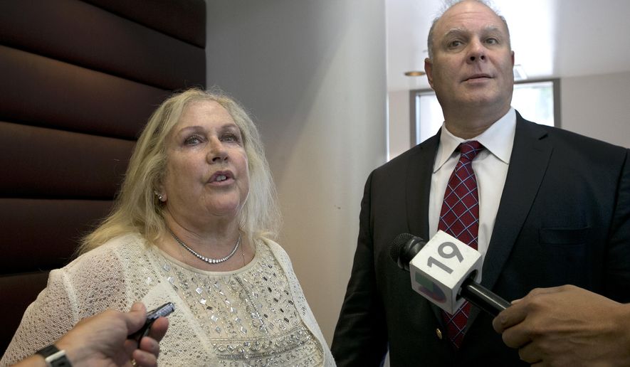 Attorneys Linda Parisi and Mark Reichel talk to reporters after a hearing held for their clients in Sacramento Superior Court, Monday, July 24, 2017, in Sacramento, Calif. Michael Williams, who is represented by Parisi and Porfirio Gabriel Paz, represented by Reichel, are facing rioting charges stemming from last years California state Capitol brawl between white nationalists and counter-protesters. The two counter- protesters are due back in court Aug.10. (AP Photo/Rich Pedroncelli)
