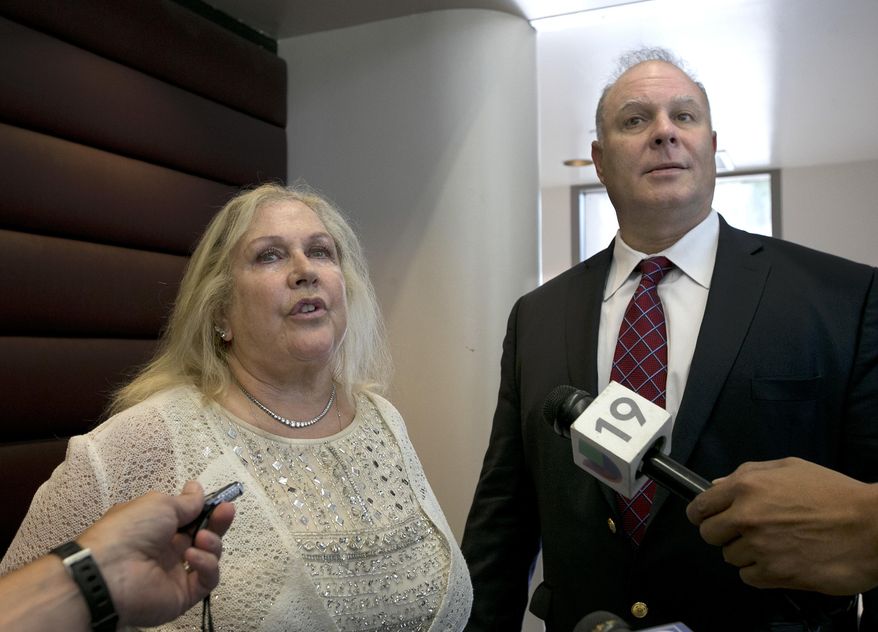 Attorneys Linda Parisi and Mark Reichel talk to reporters after a hearing held for their clients in Sacramento Superior Court, Monday, July 24, 2017, in Sacramento, Calif. Michael Williams, who is represented by Parisi and Porfirio Gabriel Paz, represented by Reichel, are facing rioting charges stemming from last years California state Capitol brawl between white nationalists and counter-protesters. The two counter- protesters are due back in court Aug.10. (AP Photo/Rich Pedroncelli)