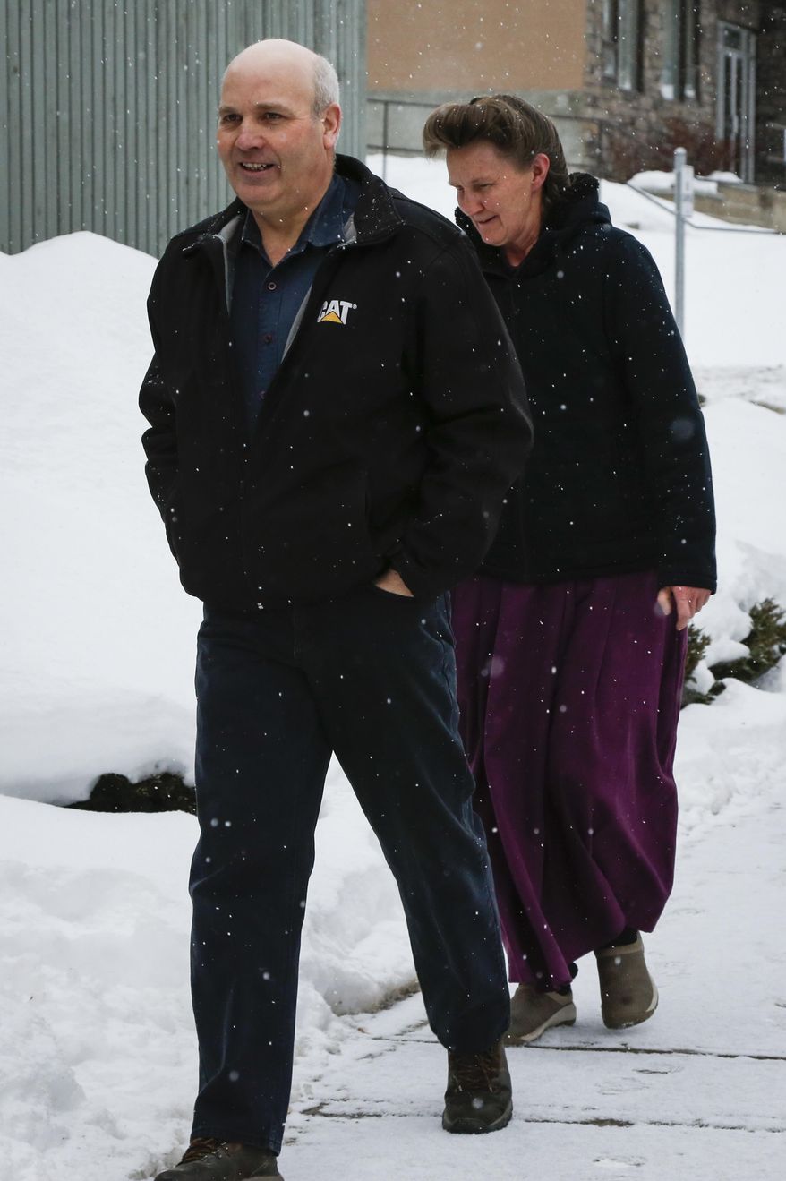 FILE - This Feb. 3, 2017, file photo, Gail Blackmore, right, and James Oler arrive at the courthouse in Cranbrook, British Columbia. Two former bishops of an isolated religious commune in British Columbia were convicted Monday, July 24, of practicing polygamy after a decades-long legal fight launched by the provincial government. The court found James Oler married five women in so-called "celestial" marriages involving residents in the tiny religious community of Bountiful. (Jeff McIntosh/The Canadian Press via AP, File)
