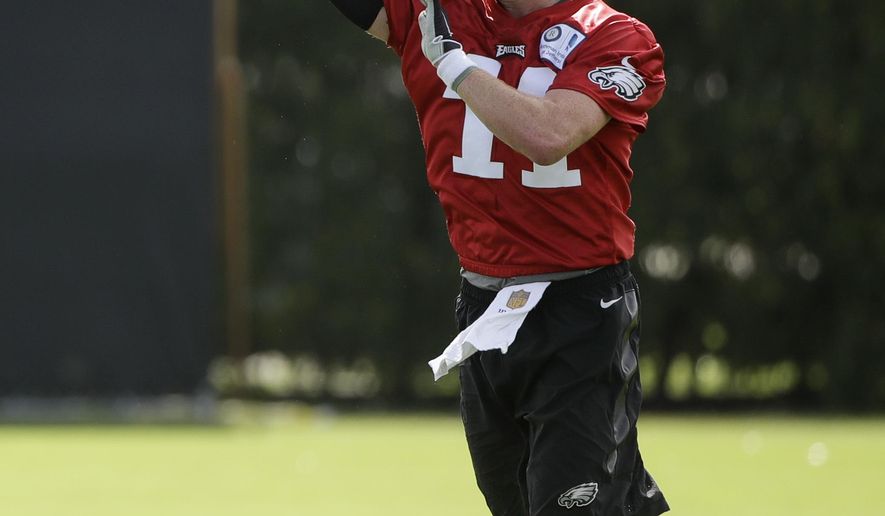 Philadelphia Eagles quarterback Carson Wentz throws a pass during an NFL football training camp in Philadelphia, Monday, July 24, 2017. (AP Photo/Matt Rourke)