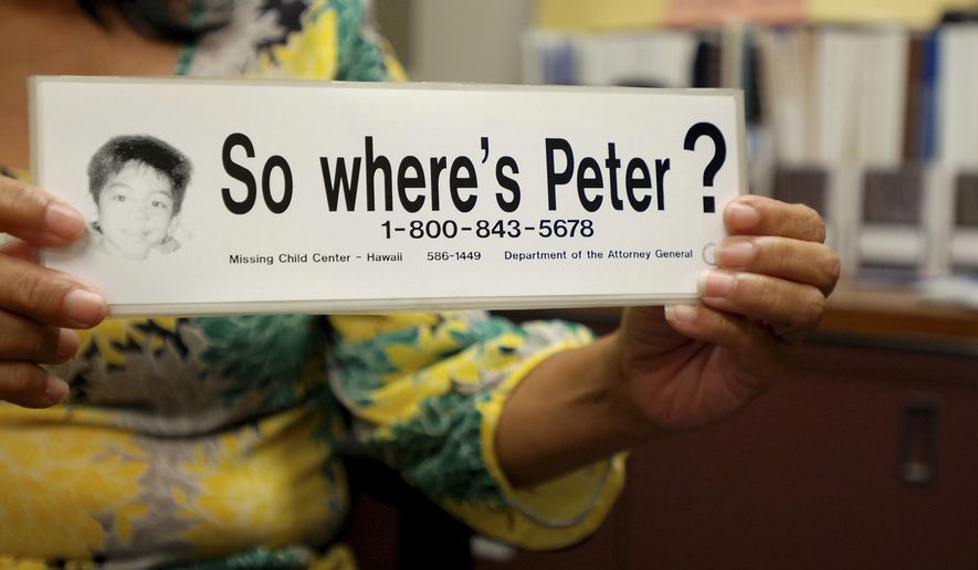 FILE - This June 6, 2016, file photo taken in Honolulu, shows a bumper sticker Hawaii officials distributed in a campaign for a Hawaii boy who disappeared 20 years earlier. The child, known as "Peter Boy," became the face of missing and abused children in the late 1990s and early 2000s. The father of the boy led police to the site Sunday, April 23, 2017, where he said he'd disposed of his son's remains. Peter Kema Sr., is providing information about the location of the boy's body as part of a plea deal. Kema Sr. is scheduled to be sentenced for manslaughter, Monday, July 24, 2017. (AP Photo/Jennifer Sinco Kelleher, File)